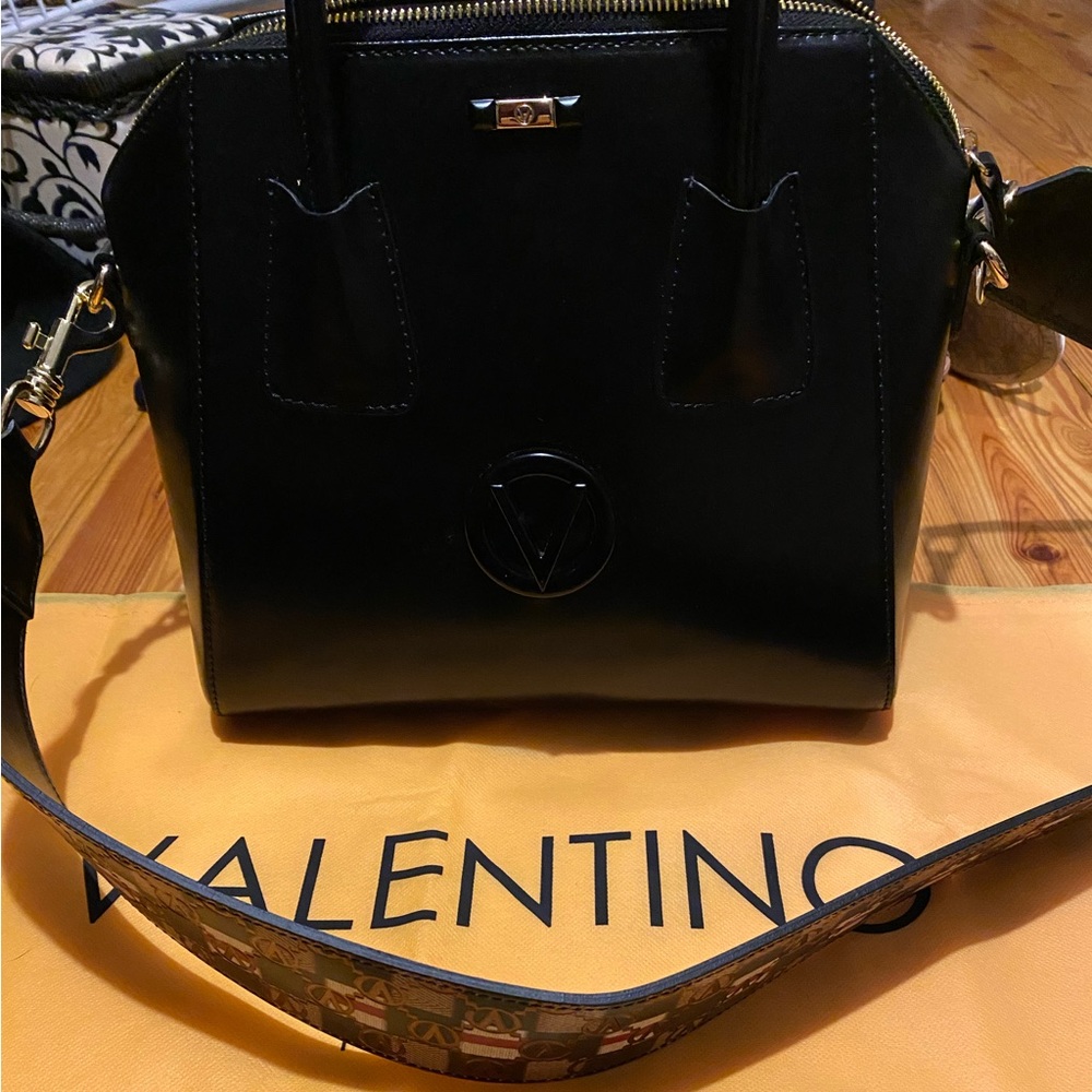 Mario Valentino bag with crossbody strap.